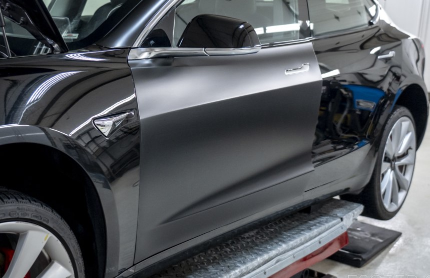 Tesla Model 3 in black during satin PPF install